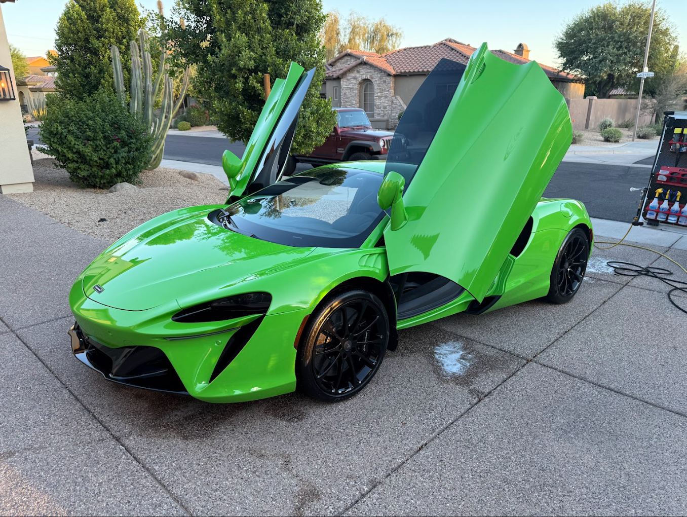 McLaren Artura in green with doors up after detail